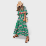 Elegantes grünes Maxikleid mit geometrischem Muster